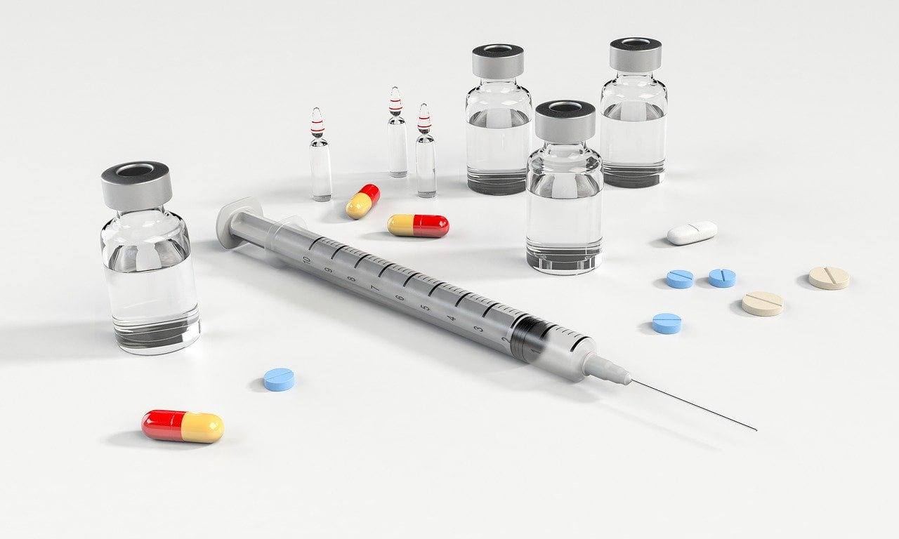 Syringe and tablets