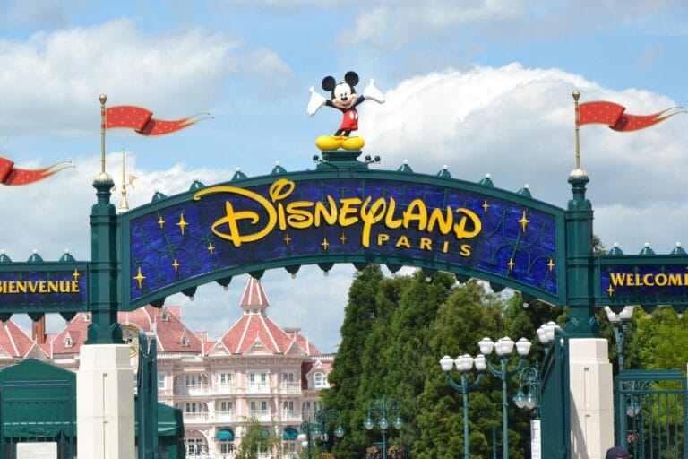 Disneyland Paris main entrance arch with Mickey Mouse clock for disability pass visitors